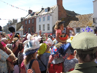 The crowd waving at the camera